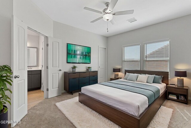 1205 Night Sky St, Horizon City, TX 79928 - bedroom with ceiling fan, ensuite bathroom, visible vents, and light colored carpet