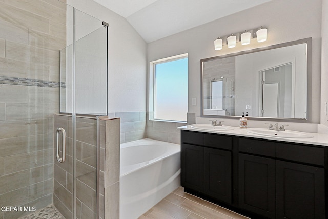 1205 Night Sky St, Horizon City, TX 79928 - bathroom featuring a garden tub, a sink, double vanity, and a stall shower