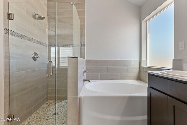 1205 Night Sky St, Horizon City, TX 79928 - full bath featuring a garden tub, vanity, and a stall shower