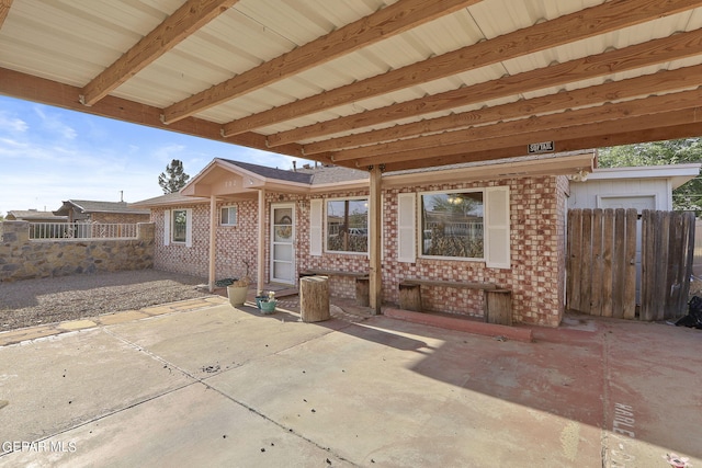 view of patio / terrace with fence