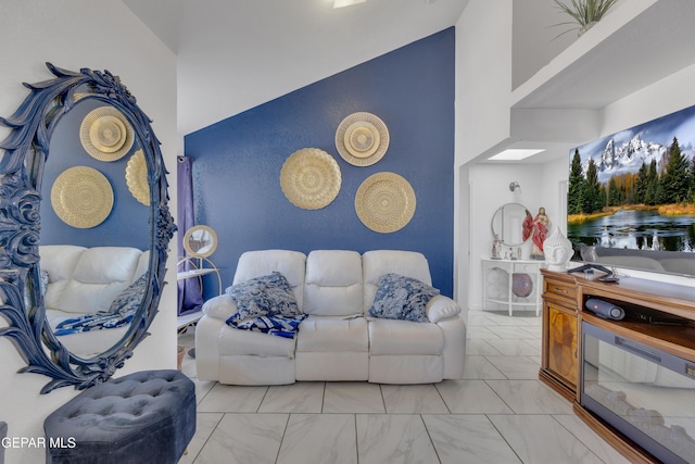 living room with a high ceiling and marble finish floor