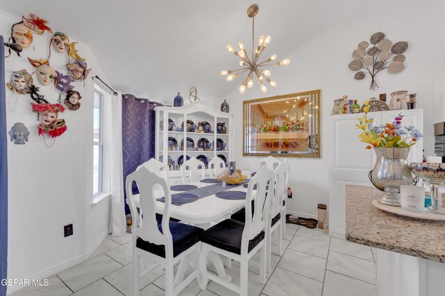 dining room with baseboards, marble finish floor, a chandelier, and a healthy amount of sunlight