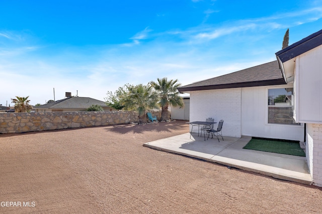 view of yard with a patio area and fence
