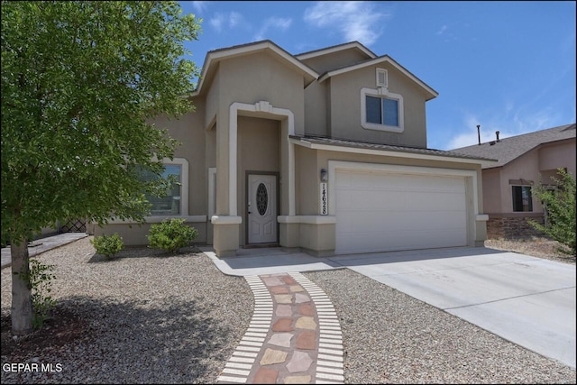 traditional home with stucco siding, concrete driveway, and an attached garage