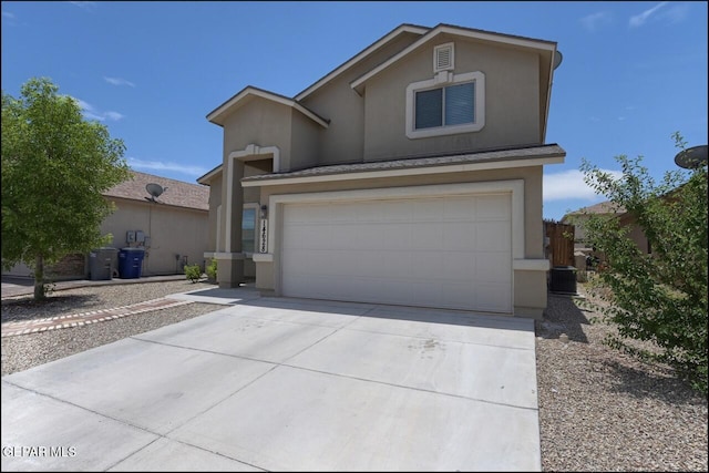 traditional-style home featuring stucco siding, driveway, and central AC unit