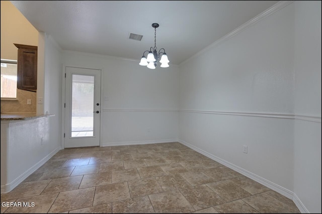 unfurnished dining area with stone finish floor, crown molding, visible vents, baseboards, and an inviting chandelier