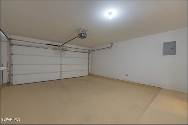 garage featuring electric panel and a garage door opener