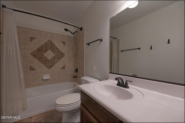 full bath featuring toilet, shower / bath combo with shower curtain, and vanity