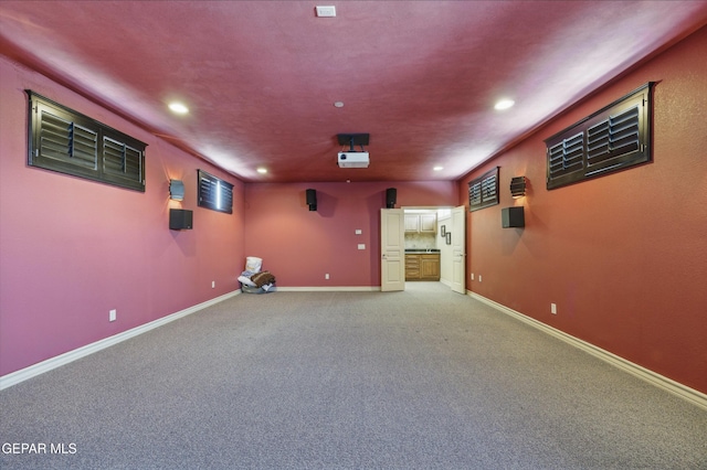 home theater featuring recessed lighting, baseboards, and light colored carpet