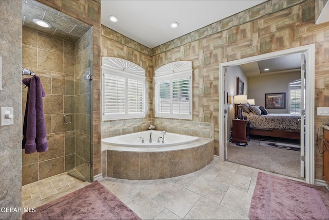 ensuite bathroom with recessed lighting, a bath, a stall shower, and connected bathroom