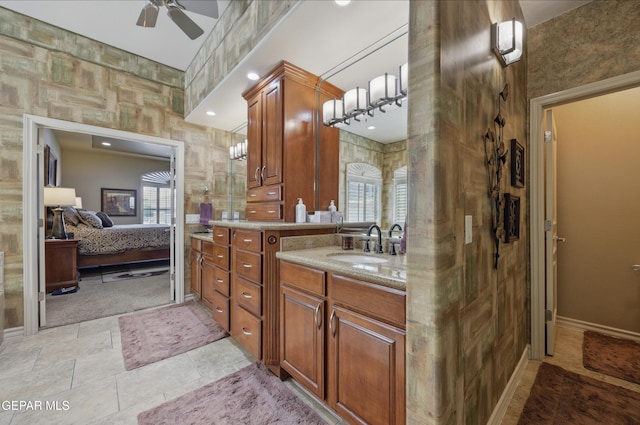 full bath with a ceiling fan, vanity, ensuite bathroom, and a healthy amount of sunlight