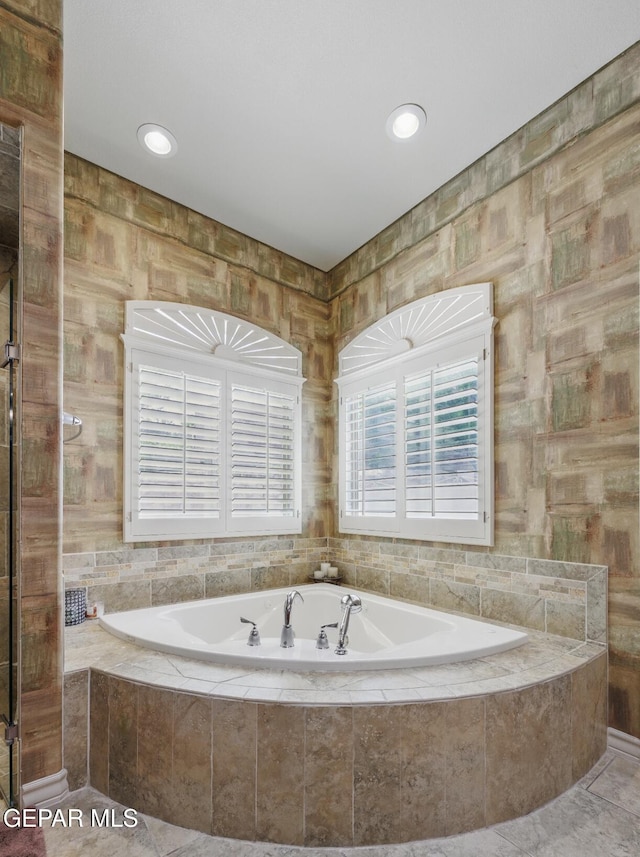 bathroom with a bath and recessed lighting