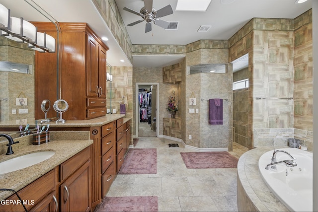 full bathroom featuring a bath, visible vents, ceiling fan, and a walk in shower