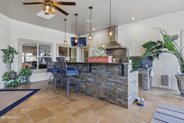 view of patio with outdoor wet bar, visible vents, and area for grilling