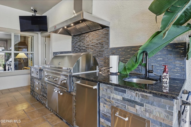 view of patio with grilling area, a sink, and exterior kitchen