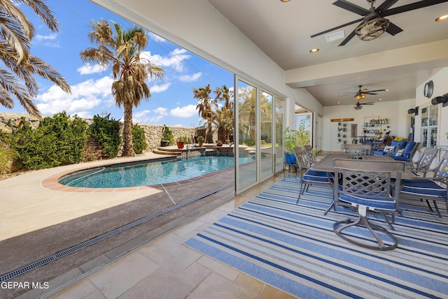 view of pool with a patio area, a fenced in pool, and a ceiling fan
