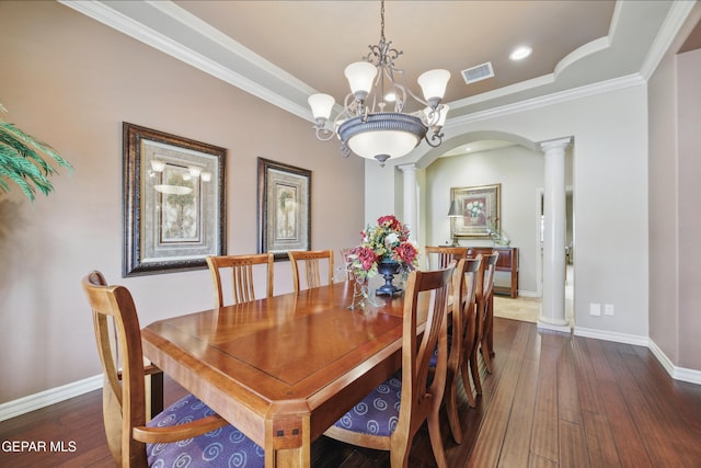 dining space featuring visible vents, baseboards, decorative columns, and dark wood-style floors