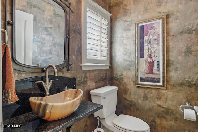 bathroom featuring a sink and toilet