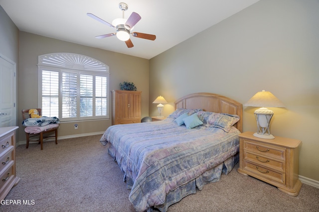 bedroom featuring baseboards, a ceiling fan, and light colored carpet