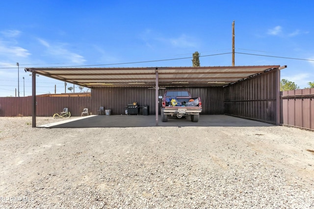 9966 Morocco Cir, El Paso, TX 79927 - view of parking featuring dirt driveway, fence, and a carport