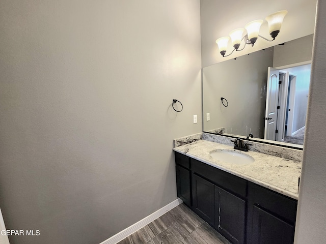 bathroom with vanity and baseboards