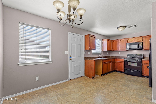 14310 Pacific Point Dr, El Paso, TX 79938 - kitchen with black appliances, a chandelier, brown cabinets, a sink, and baseboards