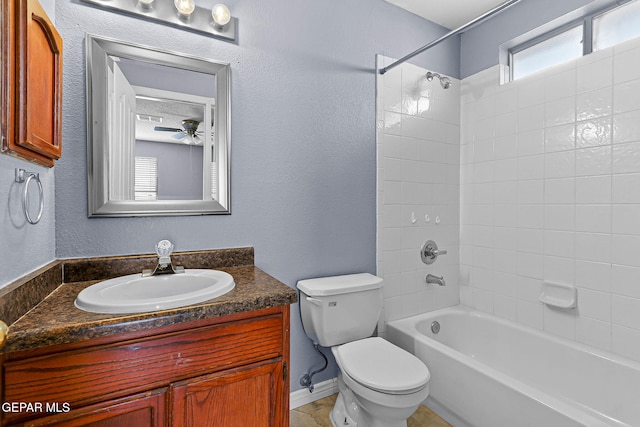 14310 Pacific Point Dr, El Paso, TX 79938 - bathroom featuring vanity, toilet, tub / shower combination, ceiling fan, and a textured wall