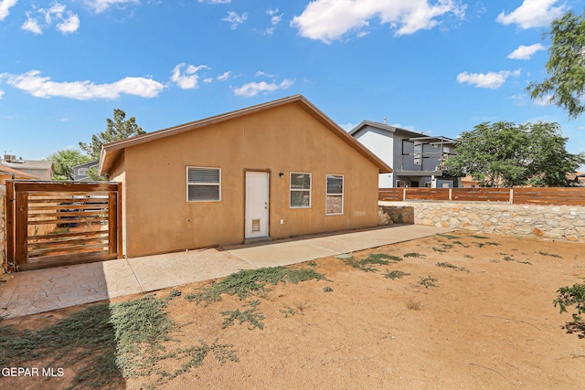14310 Pacific Point Dr, El Paso, TX 79938 - rear view of house featuring a patio area, a gate, and stucco siding