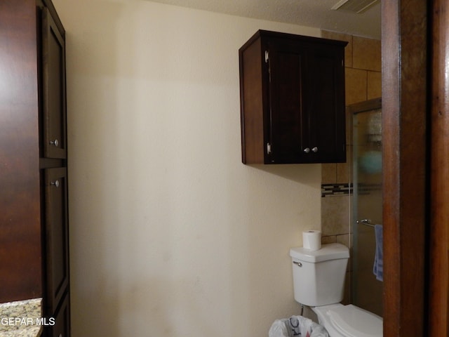 bathroom with visible vents and toilet