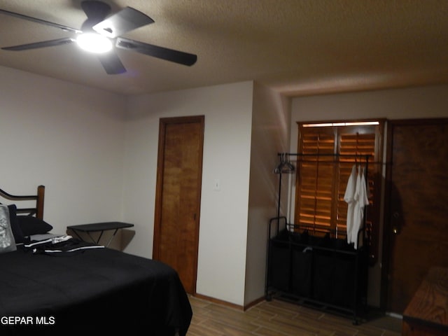 bedroom featuring ceiling fan and wood finished floors