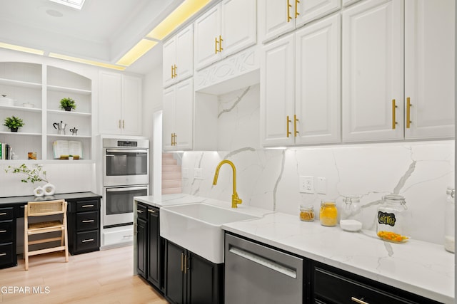 kitchen with white cabinets, stainless steel appliances, open shelves, decorative backsplash, and dark cabinets