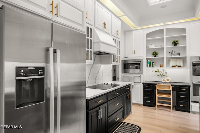 kitchen featuring white cabinets, open shelves, dark cabinetry, light wood-style flooring, and appliances with stainless steel finishes