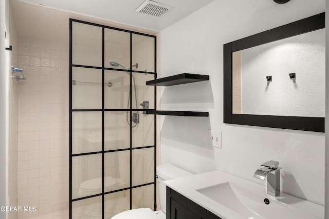 full bath featuring visible vents, vanity, a walk in shower, and toilet