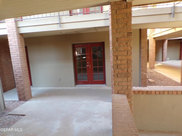 view of exterior entry featuring french doors