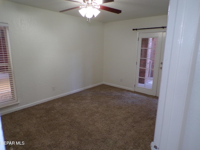 unfurnished room with ceiling fan, carpet floors, and baseboards