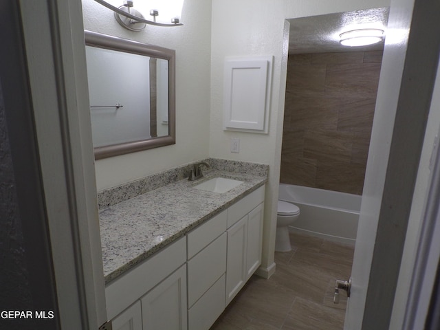 bathroom with toilet and vanity