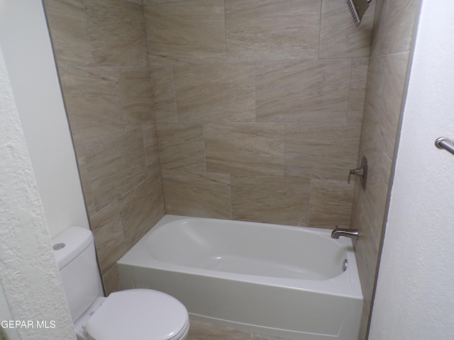 full bathroom featuring toilet and shower / bathing tub combination