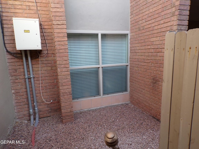 exterior details featuring brick siding
