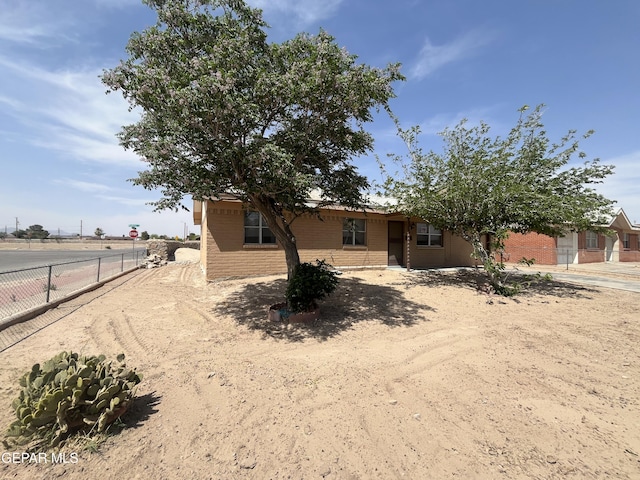 200 Romeria Dr, El Paso, TX 79907 - view of front of home with brick siding and fence