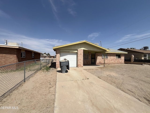 276 Romeria Dr, El Paso, TX 79907 - ranch-style house featuring a garage, brick siding, concrete driveway, and fence