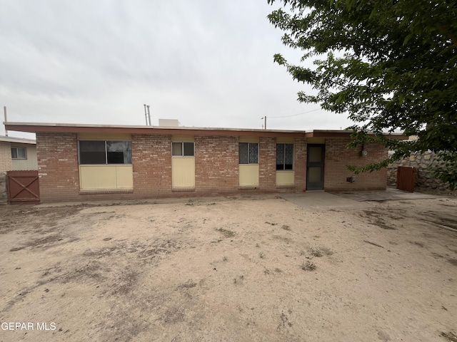 view of front of house with brick siding