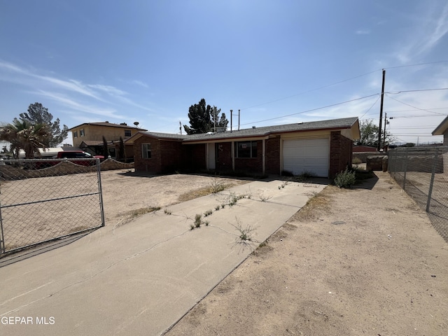 ranch-style house featuring concrete driveway, brick siding, fence, and a garage