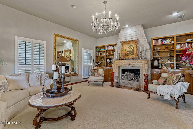 carpeted living room featuring baseboards, visible vents, a fireplace, and a chandelier