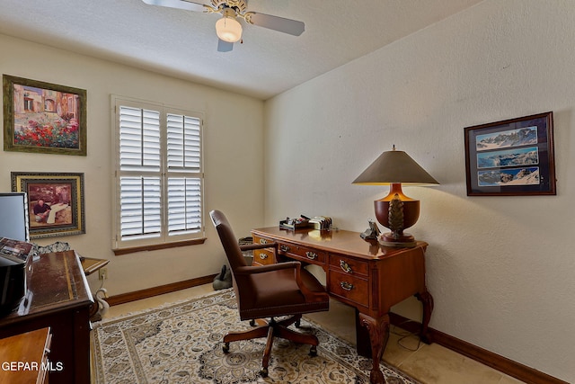 home office with baseboards and a ceiling fan