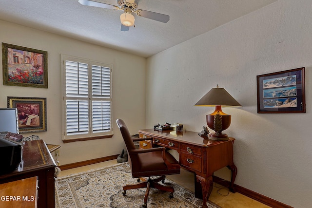 office space featuring baseboards and a ceiling fan