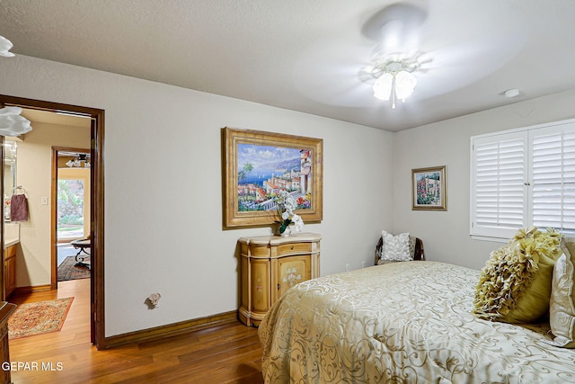 628 Spring Crest Dr, El Paso, TX 79912 - bedroom featuring baseboards, light wood-style floors, and ceiling fan