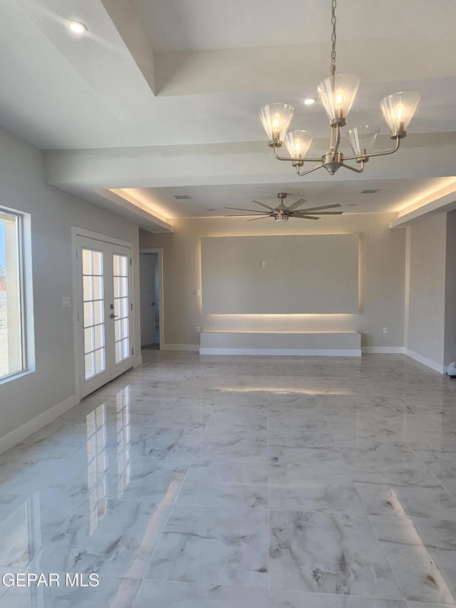 474 Sylvia Ct, Socorro, TX 79927 - unfurnished living room with a chandelier, a tray ceiling, marble look tile flooring, a ceiling fan, and french doors