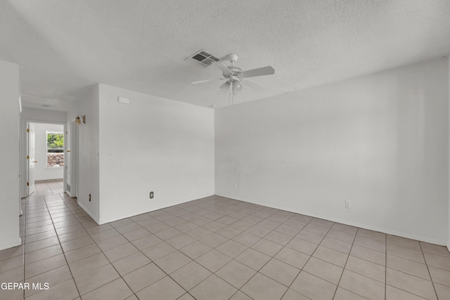 2352 Tierra Blanda Dr, El Paso, TX 79938 - empty room featuring a textured ceiling, visible vents, a ceiling fan, and light tile patterned floors