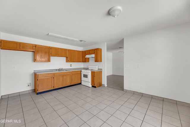 2352 Tierra Blanda Dr, El Paso, TX 79938 - kitchen with a sink, light countertops, under cabinet range hood, visible vents, and gas range gas stove