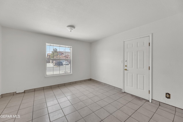 2352 Tierra Blanda Dr, El Paso, TX 79938 - spare room featuring light tile patterned flooring and a textured ceiling